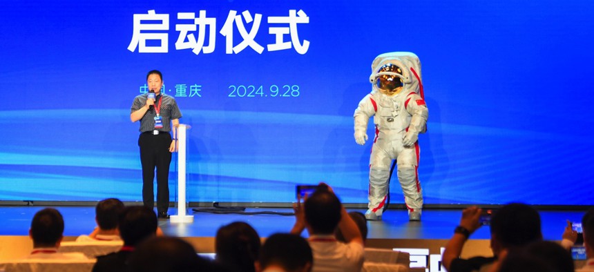 Yang Liwei, deputy chief designer of China's manned space program and China's first taikonaut, unveils the China Manned Space Agency's moon-landing spacesuit on Sept. 28, 2024. 