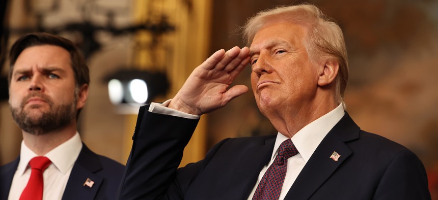 U.S. President Donald Trump salutes as he and Vice President JD Vance listen to the performance of the national anthem during the inauguration ceremony, Jan. 20, 2025.