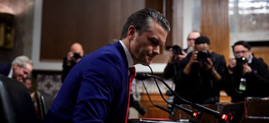 Defense Secretary nominee Pete Hegseth stands after a Senate Armed Services confirmation hearing on Capitol Hill on January 14, 2025, in Washington, D.C.