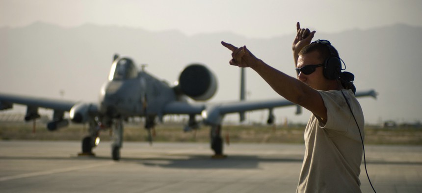 In this 2008 photo, a crew chief with the 455th Expeditionary Aircraft Maintenance Squadron directs an A-10 Thunderbolt II at Bagram Air Field, Afghanistan.