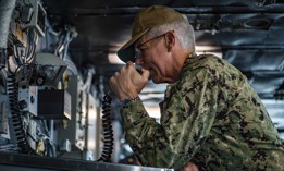 Vice Adm. Karl Thomas addresses the crew of Nimitz-class aircraft carrier USS Carl Vinson during a visit in 2021.