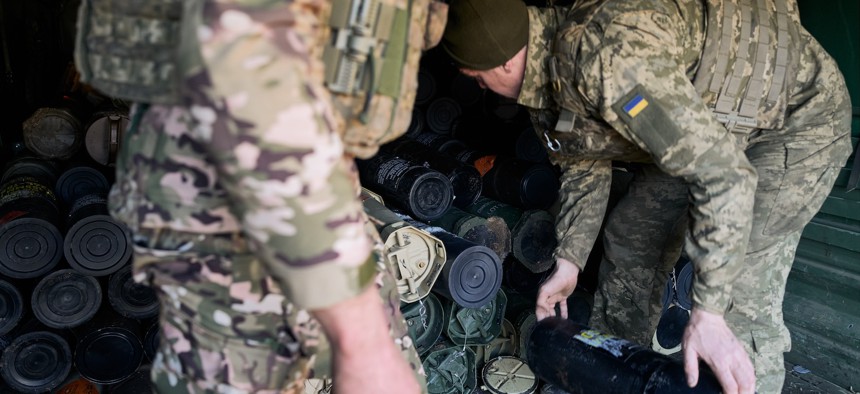  Servicemen of the 155th Brigade of the Armed Forces of Ukraine load empty casings onto a military truck amid artillery shelling on the frontline on February 9, 2025, in Pokrovsk, Ukraine. 