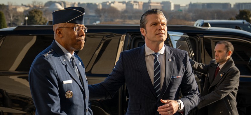 Gen. C.Q. Brown, left, with Defense Secretary Pete Hegseth on Hegseth's arrival to the Pentagon, Jan. 27, 2025. 