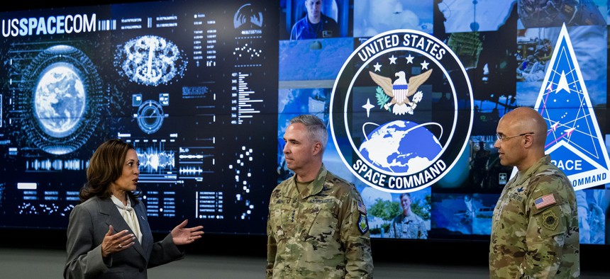 In this 2024 photo, then-Vice President Kamala Harris speaks with Gen. Stephen Whiting, U.S. Space Command commander, and Lt. Gen. David Miller, Space Operations Command commander, at USSPACECOM’s headquarters, Peterson Space Force Base, Colorado.
