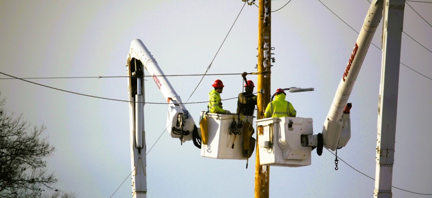 Contractors work on power lines Feb. 4, 2025, at Fort McCoy, Wis.