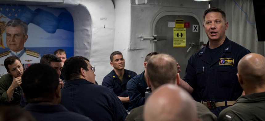 The author in 2018, aboard the Arleigh Burke-class guided-missile destroyer USS Stockdale. 