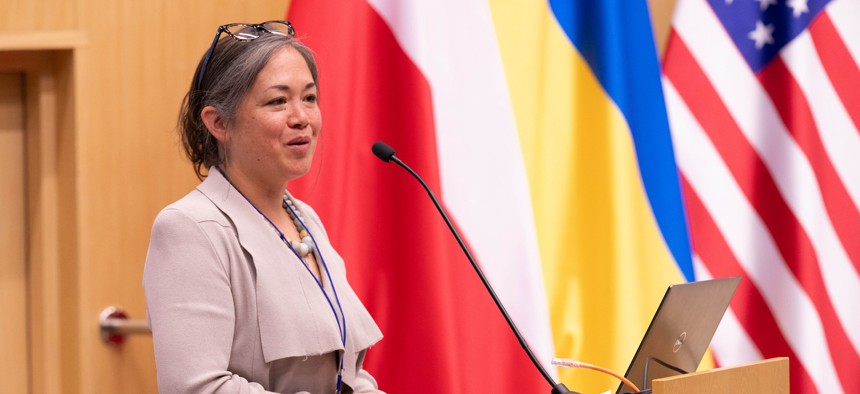 U.S. Defense Innovation Unit, Deputy Director of Commercial Operations, Liz Young McNally speaks at an innovation event in Kraków, Poland, in June 2024.