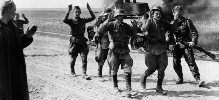 Soviet soldiers surrender to German troops on June 22, 1941. Adolph Hitler's decision to invade was shaped by Joseph Stalin's purge of thousands of Red Army officers.