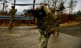 A U.S. soldier assigned to 3rd Brigade, 10th Mountain Division sets up a Ghost drone to conduct surveillance during a live fire exercise at the 7th Army Training Command's Grafenwoehr Training Area, Germany, Feb. 25, 2025.