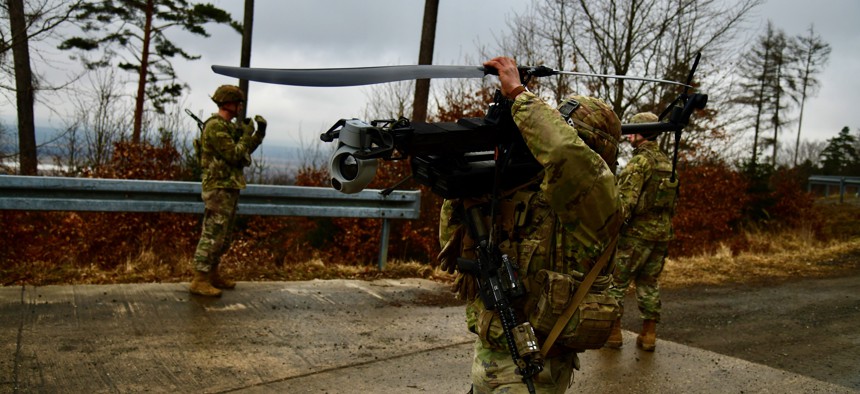 A U.S. soldier assigned to 3rd Brigade, 10th Mountain Division sets up a Ghost drone to conduct surveillance during a live fire exercise at the 7th Army Training Command's Grafenwoehr Training Area, Germany, Feb. 25, 2025.