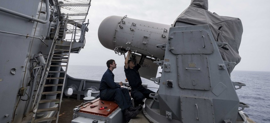 Fire Controlman Seaman Zane Doerner, right, and Fire Controlman 3rd Class Dylan Hooper conduct routine maintenance on the search and track radar of the USS Wasp’s close-in weapons system, June 27, 2024.