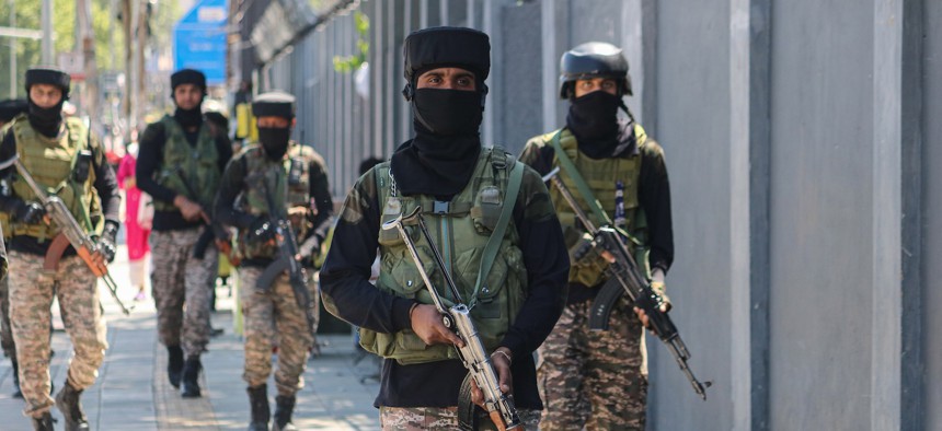 Indian paramilitary soldiers patrol along a street in Srinagar, Jammu and Kashmir, on May 12, 2025.