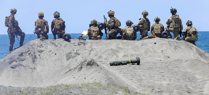 U.S. Army soldiers assigned to 1st Battalion, 21st Infantry Regiment, 2nd Mobile Brigade Combat Team, 25th Infantry Division and U.S. Marines with 3rd Littoral Combat Team, 3rd Marine Littoral Regiment, view the impact of a Javelin missile during Exercise Balikatan 25 in the Philippines, May 3, 2025.