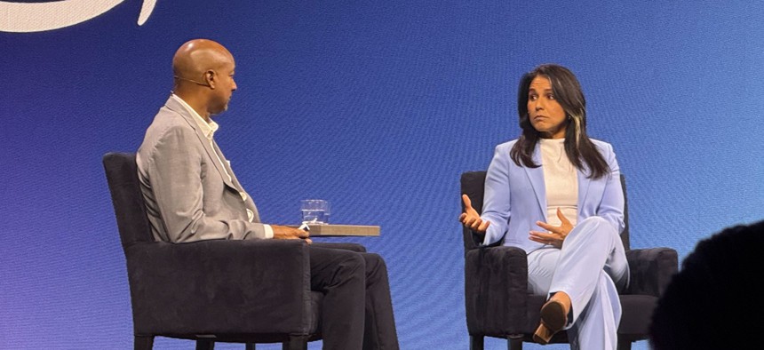 Director of National Intelligence Tulsi Gabbard speaks with Vice President of Amazon Web Services' Worldwide Public Sector Dave Levy on June 10 at the AWS public sector conference.