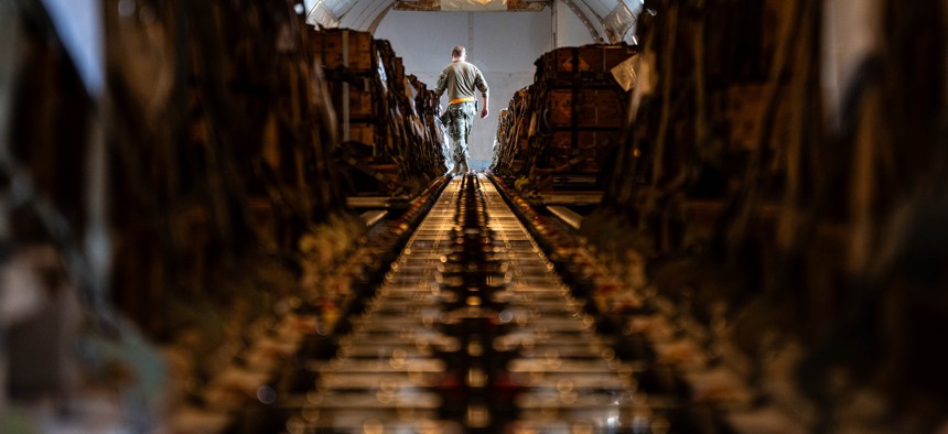 A U.S. Air Force air transportation specialist assigned inspects cargo to be sent to Ukraine and other partners, Dec. 17, 2024.