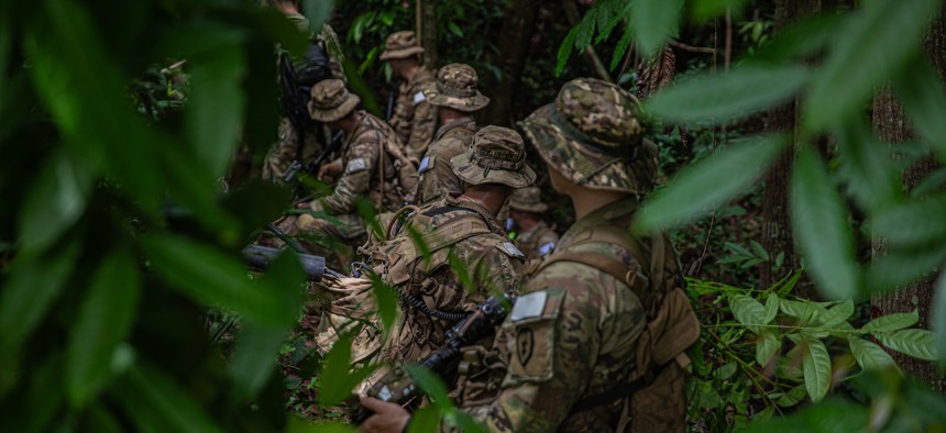 U.S. Army soldiers assigned to the 25th Infantry Division navigate forest terrain at Jungle School, during Salaknib 25 in the Philippines, June 19, 2025.