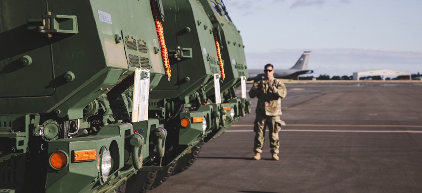 A soldier assigned to 25th Infantry Division stages High Mobility Artillery Rocket System (HIMARS) launchers at Joint Base Pearl Harbor-Hickam, July 14, 2025.
