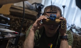 Ukrainian military personnel work at an FPV drone assembly center in Donetsk Oblast, Ukraine, May 14, 2025.