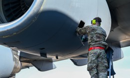 Staff Sgt. Patrick Garrett, 512th Maintenance Squadron, adds jet engine oil into a C-17 Globemaster III aircraft on Yokota Air Base, Japan, March 17, 2025.