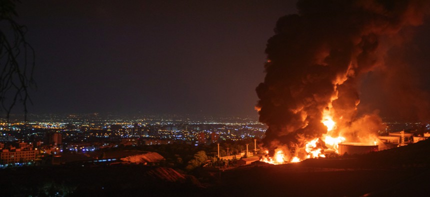 Fire and smoke rise into the sky after an Israeli attack on the Shahran oil depot on June 15, 2025, in Tehran, Iran.