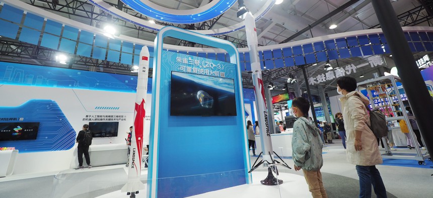 Visitors view a model of the Suzaku III Reusable Rocket during the 2024 Beijing Science and Technology Activity Week in China, on May 25, 2024.