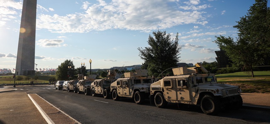 Military vehicles parked near the Washington Monument on August 12, 2025.