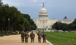 National Guardmen walk on the National Mall on August 14, 2025, in Washington, D.C., after President Donald Trump's deployment of federal forces and takeover of the city's police department.