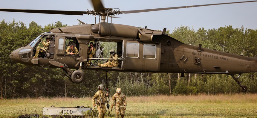 Soldiers from the Illinois National Guard conduct sling-load training with UH-60 Blackhawk Helicopters at Camp Ripley Training Center in Minnesota, on August 11, 2025.