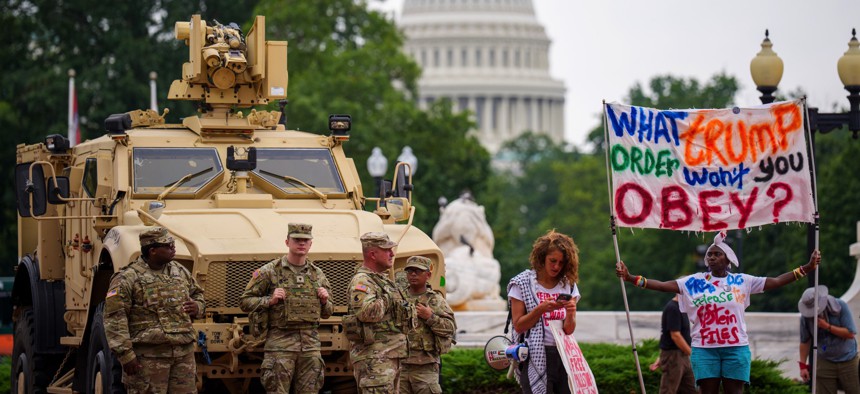 National Guard troops and protestors outside Union Station in Washington, D.C., on August 20, 2025,