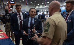 Defense Innovation Unit Director Doug Beck speaks to Master Sgt. Joshua Shelly about the Neros Archer drone during the AI+ Expo in Washington D.C., June 2, 2025. 