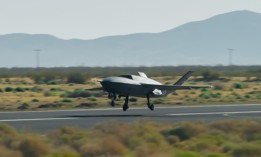 A YFQ-42A Collaborative Combat Aircraft takes off during flight testing at a California test location.
