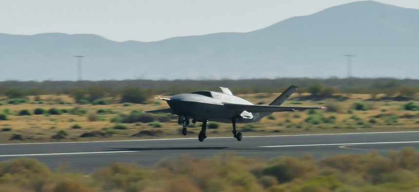 A YFQ-42A Collaborative Combat Aircraft takes off during flight testing at a California test location.
