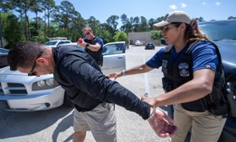ICE Enforcement and Removal Operations deportation officers conduct the simulated arrest of a suspect during vehicle-stop training at the Federal Law Enforcement Training Center in Glencoe Georgia on April 13, 2022.