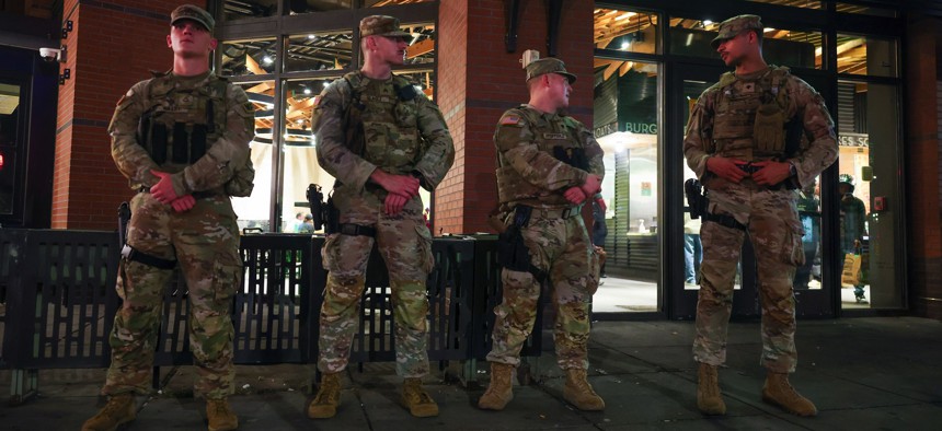 National Guard troops guard a Shake Shack on 14th Street NW in Washington, D.C., on August 24, 2025, in Washington, D.C.