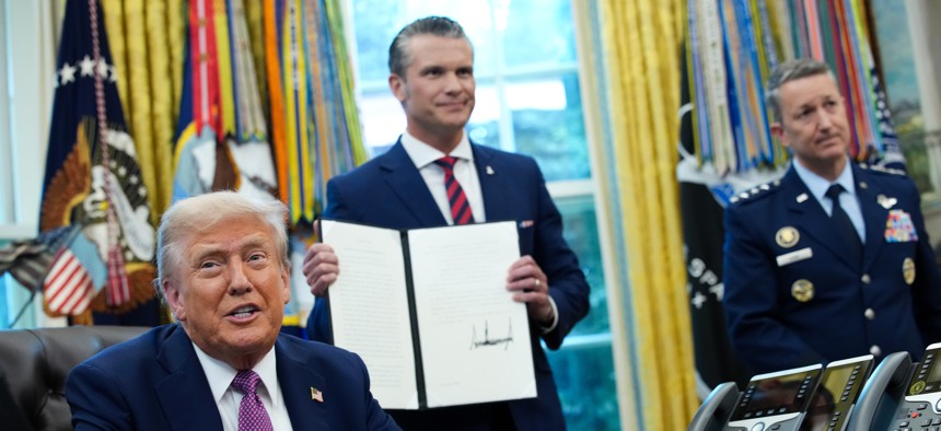At the White House on September 5, 2025, President Donald Trump ordered DOD to take on the "secondary" name of Department of War. Defense Secretary Pete Hegseth and Chairman of the Joint Chiefs of Staff Air Force Gen. Dan Caine look on.