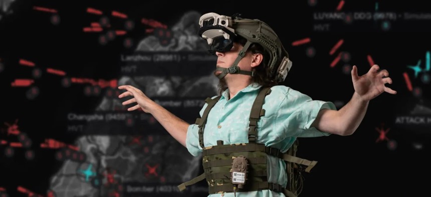 Anduril founder Palmer Luckey tries out AR goggles in February 2025.