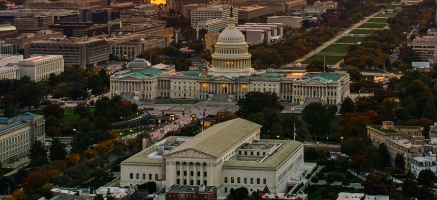 The U.S. Capitol and Supreme Court at sunset.