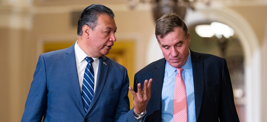 Sen. Alex Padilla, D-Calif., left, and Sen. Mark Warner, D-Va., arrived for Ukrainian President Volodymyr Zelenskyy's 2023 meeting with U.S. senators.
