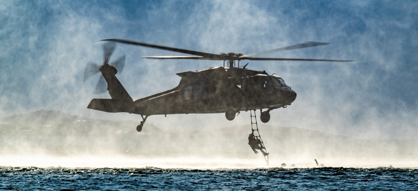A special tactics airman from the Kentucky Air National Guard boards a Mississippi Army National Guard UH-60 Black Hawk off St. Croix, U.S. Virgin Islands, Aug. 28, 2025, as part of AFSOC's Emerald Warrior exercise.