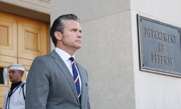 U.S. Defense Secretary Pete Hegseth waits outside the Pentagon on September 22, 2025.