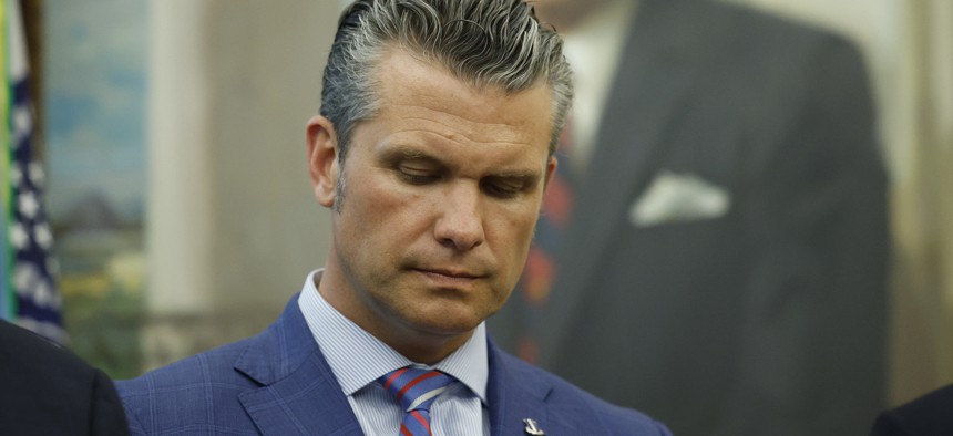 Defense Secretary Pete Hegseth listens as Donald Trump talks in the Oval Office about sending National Guard troops to Memphis, Tennessee, on September 15, 2025.