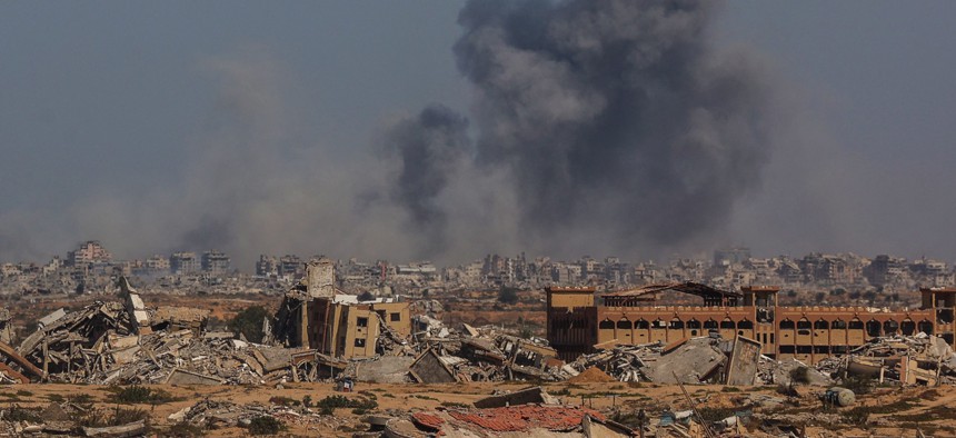 Smoke billows above Gaza City after an Israeli strike on October 2, 2025, as seen from Nuseirat in central Gaza.