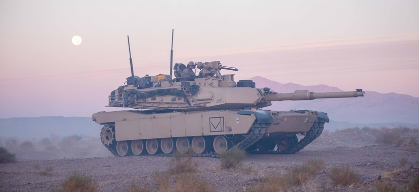 Soldiers maneuver an M1 Abrams main battle tank area at the National Training Center, Fort Irwin, Calif., Sept. 18, 2024.