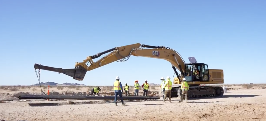 Construction on a 15-mile border fence at the Barry M. Goldwater Training Range in Arizona.