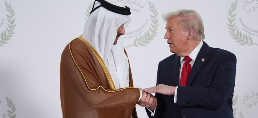 President Donald Trump greets Qatar Prime Minister and Foreign Minister Sheikh Mohammed bin Abdulrahman bin Jassim Al Thani during a world leaders' summit on ending the Gaza war on October 13, 2025, in Sharm El-Sheikh, Egypt.