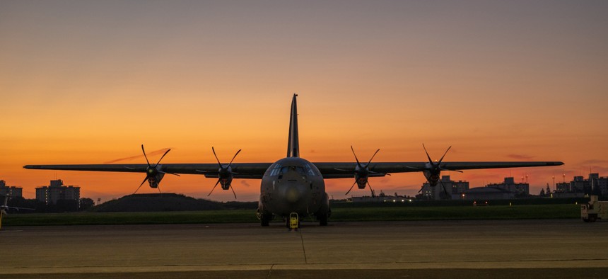 An Air Force C-130J Super Hercules aircraft rests on the flight line just before the sun rises during Exercise Resolute Force Pacific 2025 at Yokota Air Base, Japan, July 21, 2025.