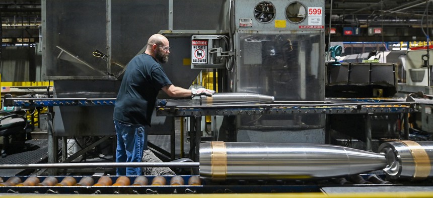 An employee at General Dynamics Scranton moves a mortar along the production line in August 2025.