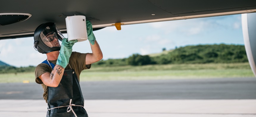  U.S. Air Force crew chief performs maintenance on a KC-46A Pegasus in Frederiksted, St. Croix, Oct. 29, 2025. 