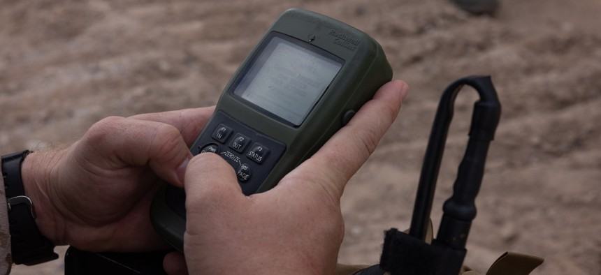 A Marine uses a defense advance GPS receiver during a close air support exercise in Yuma, Arizona, Sept. 27, 2025.