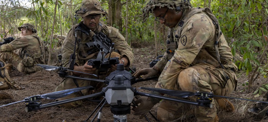 U.S. Army soldiers with the 25th Infantry Division prep a C100 Heavy-Lift Quadcopter during the Joint Pacific Multinational Readiness Center (JPMRC) rotation on Nov. 7, 2025, at Schofield Barracks, Hawaii.